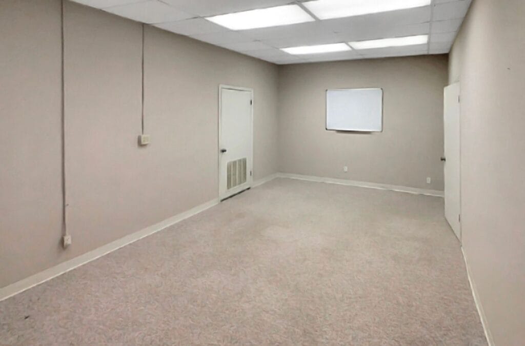 A Right Space representative showcasing a modern commercial office space in North Shelby, AL, highlighting the professional environment and amenities available.